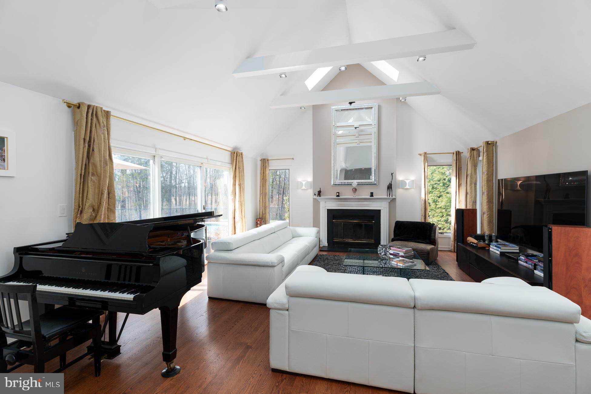 6 Andrews Lane Princeton, NJ 08540 - Photo 4 of 27 a living room with furniture a fireplace and a flat screen tv
