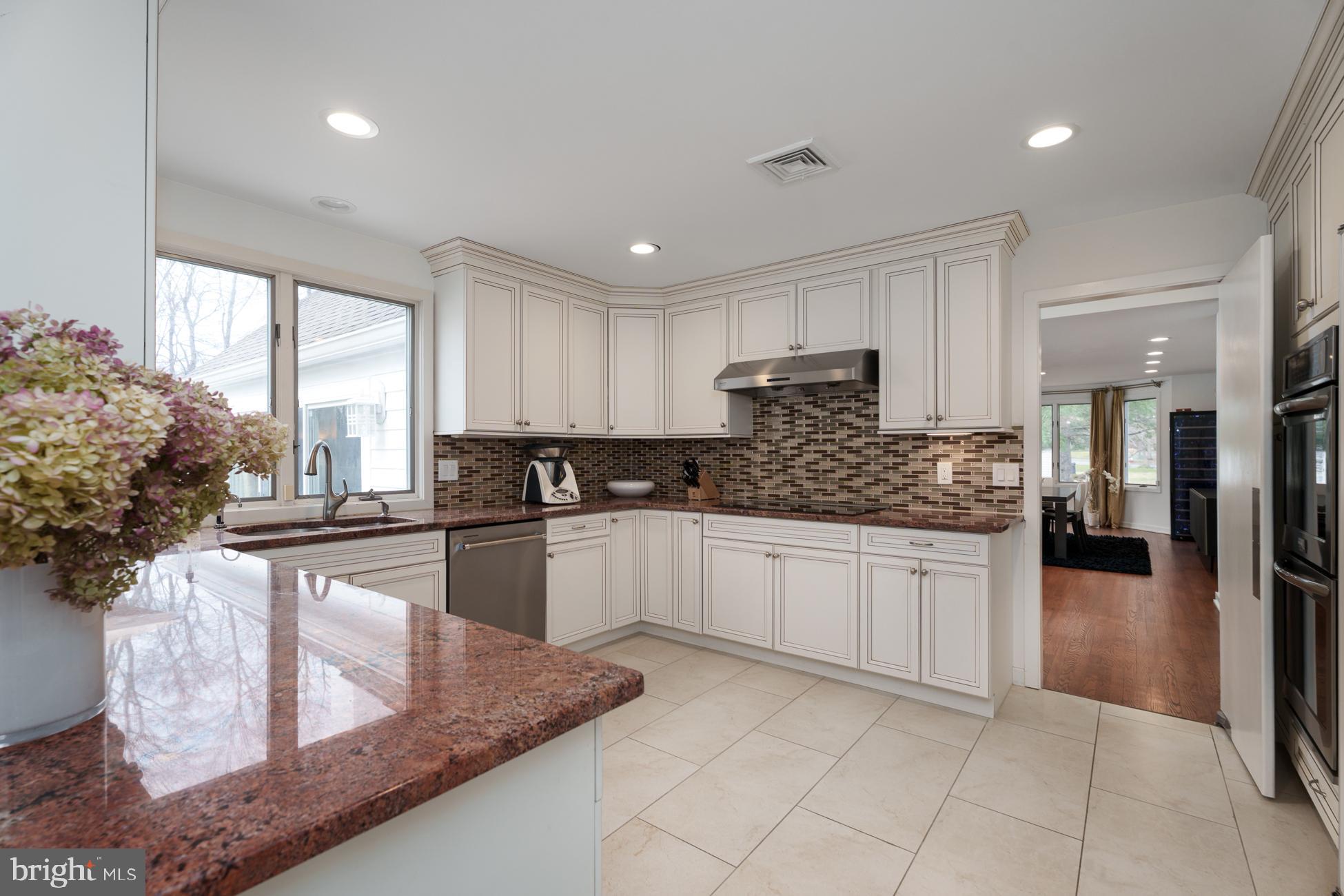 6 Andrews Lane Princeton, NJ 08540 - Photo 7 of 27 a kitchen with stainless steel appliances granite countertop a refrigerator sink and cabinets