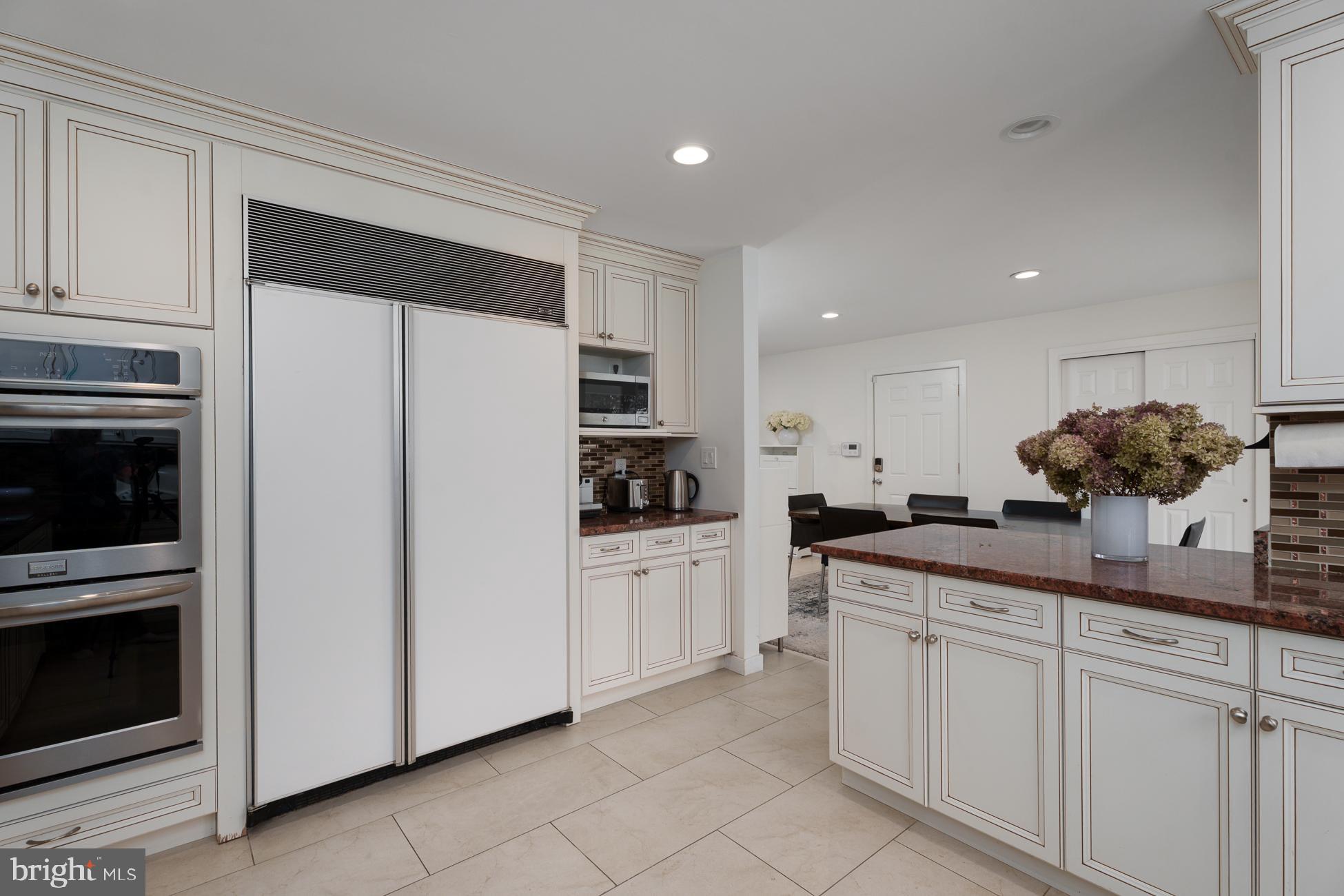 6 Andrews Lane Princeton, NJ 08540 - Photo 8 of 27 a kitchen with white cabinets and white appliances