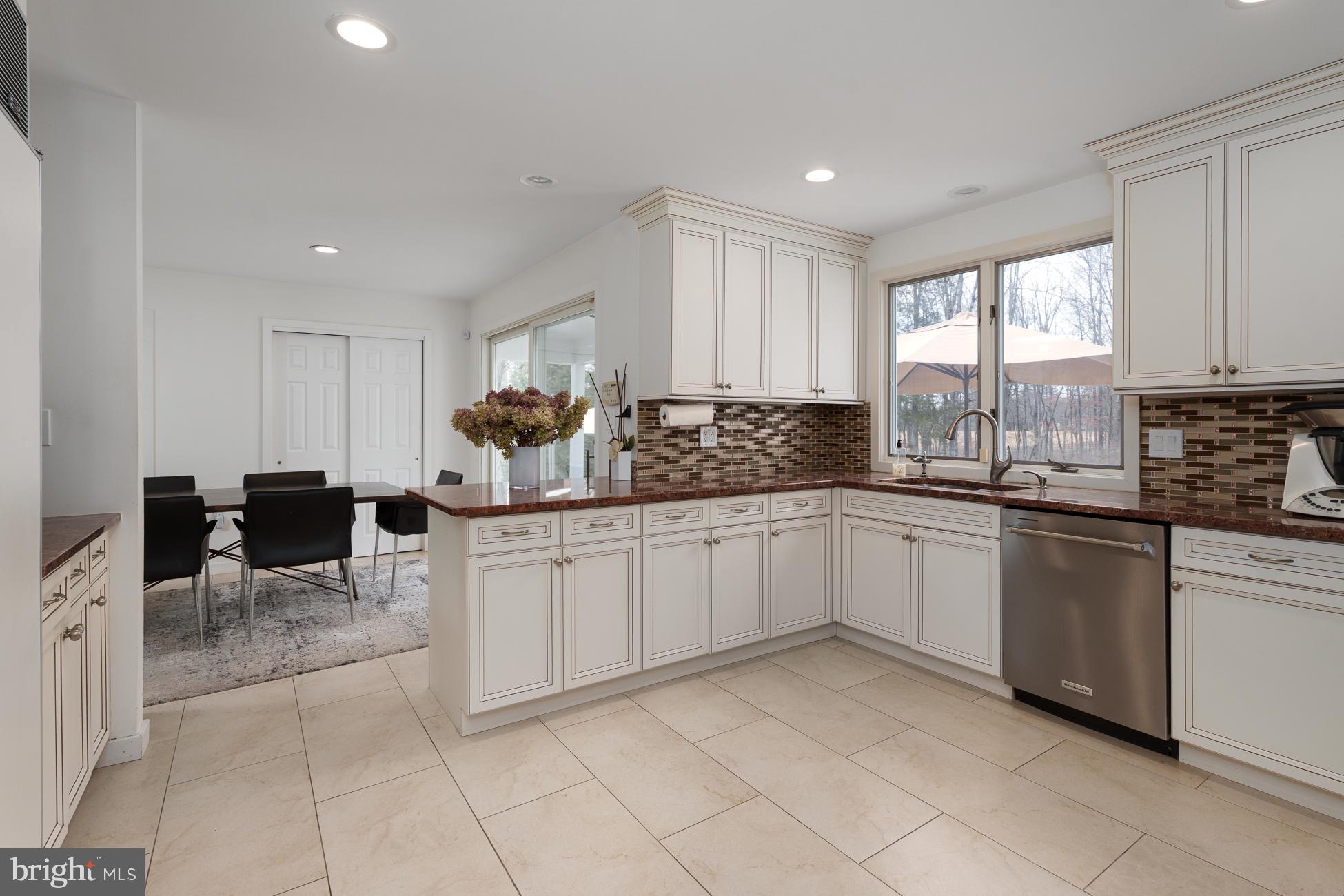 6 Andrews Lane Princeton, NJ 08540 - Photo 9 of 27 a kitchen with a sink window and cabinets