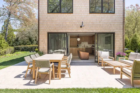 a view of a patio with a table and chairs