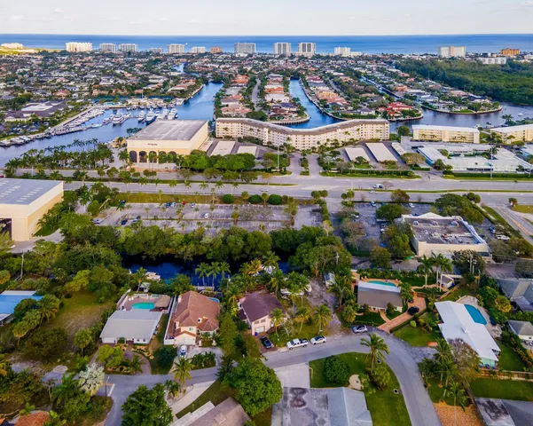 an aerial view of residential houses with outdoor space