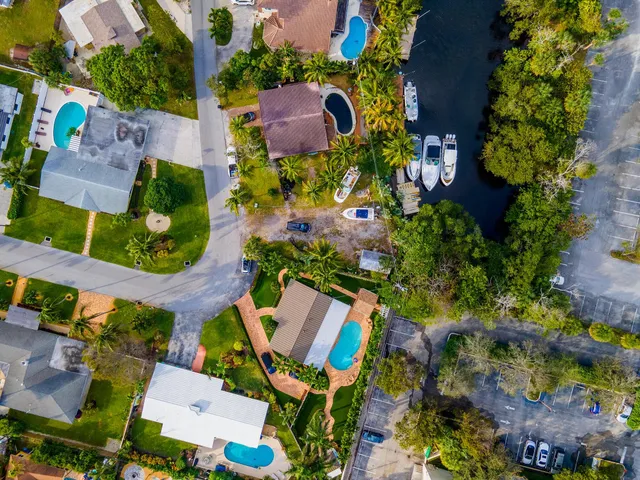 an aerial view of a house with a yard and garden