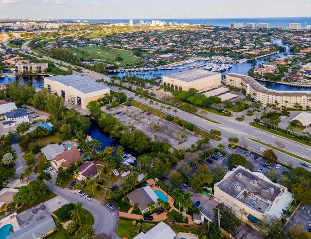 an aerial view of residential building and lake