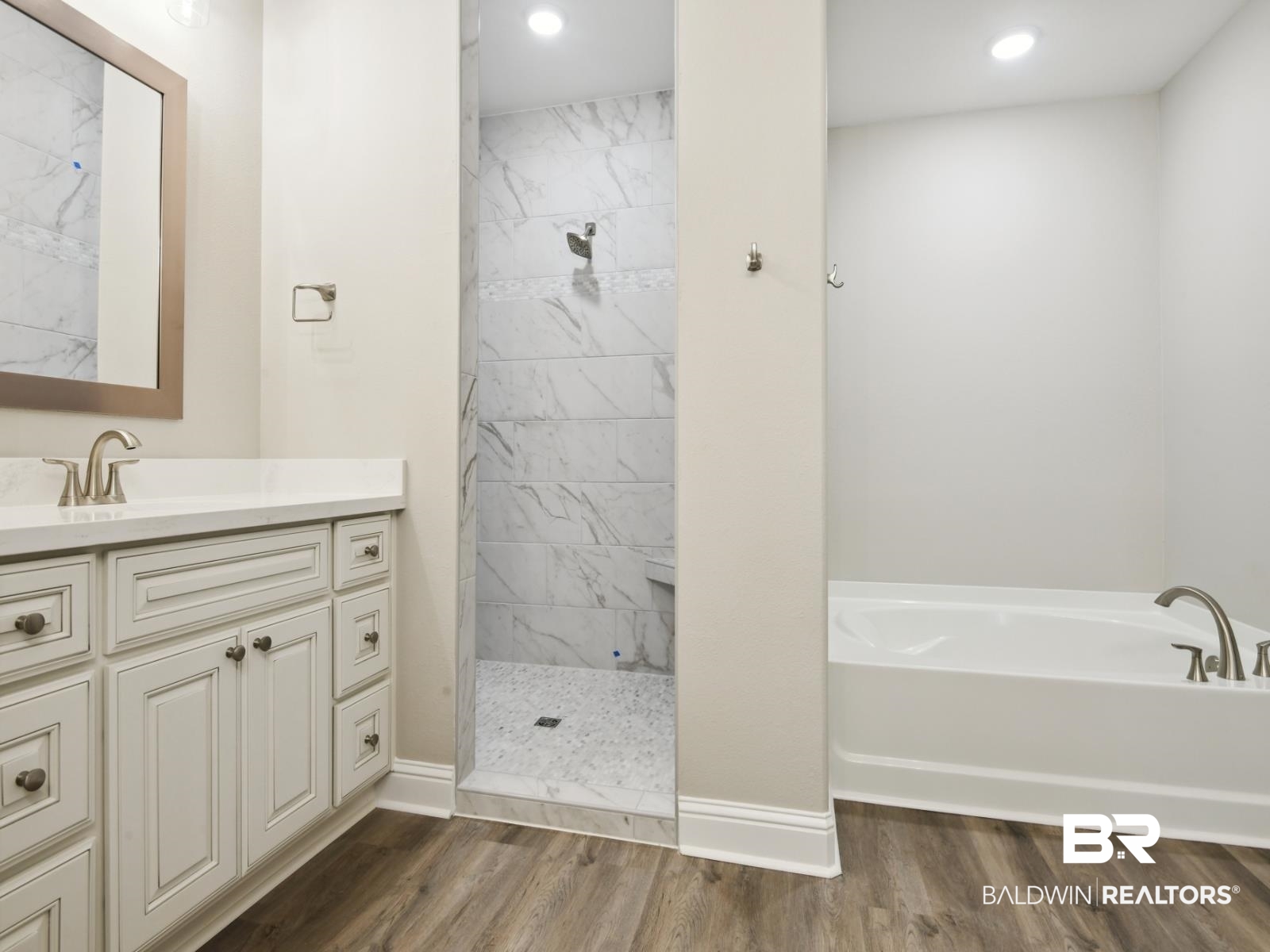 23937 Peppermint Street Elberta, AL 36530 - Photo 12 of 22 Bathroom featuring vanity, a bath, wood finished floors, a tile shower, and recessed lighting