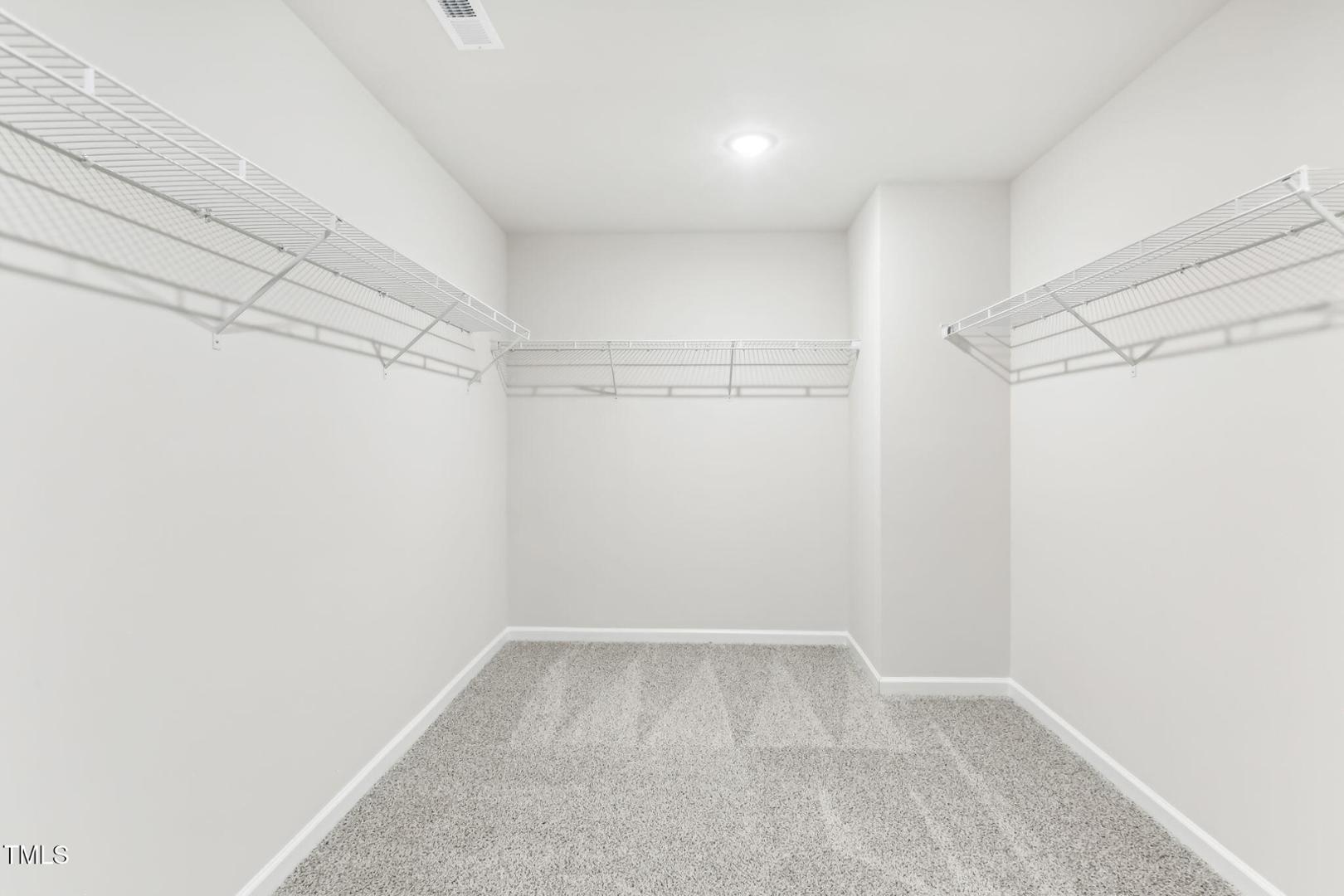 191 White Birch Lane Angier, NC 27501 - Photo 13 of 35 a view of a room with racks on the wall
