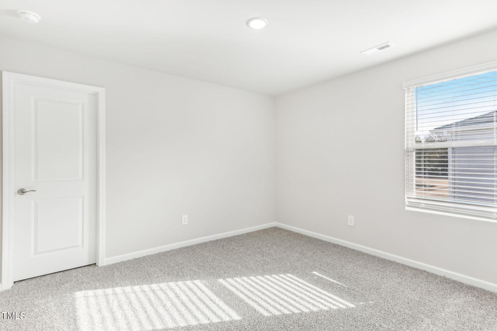 191 White Birch Lane Angier, NC 27501 - Photo 14 of 35 a view of an empty room with a window