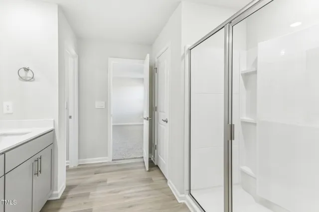 a bathroom with double sink and a mirror