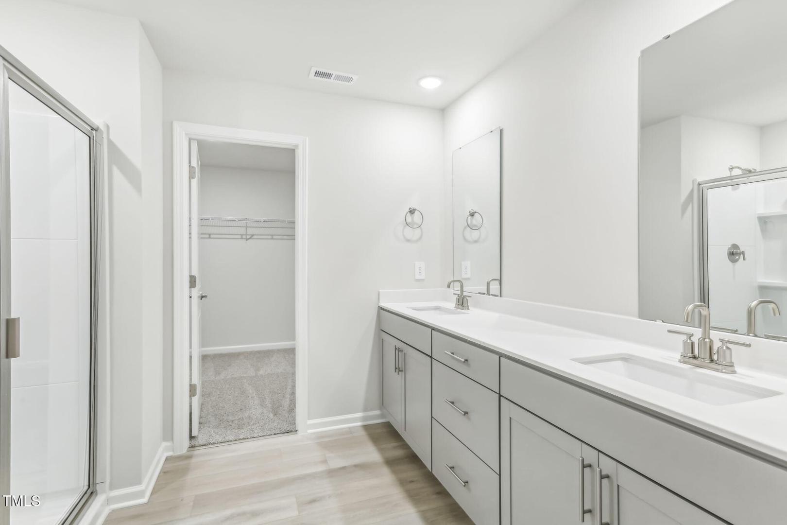 191 White Birch Lane Angier, NC 27501 - Photo 17 of 35 a bathroom with double sink and a mirror