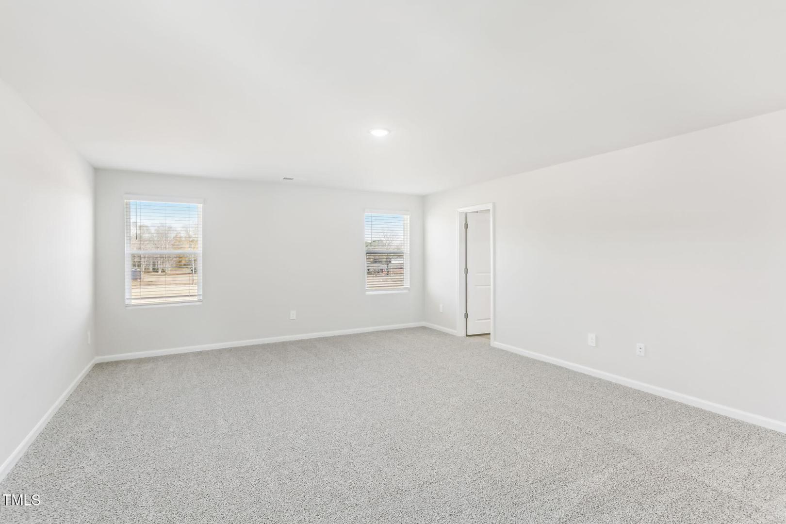 191 White Birch Lane Angier, NC 27501 - Photo 19 of 35 an empty room with windows
