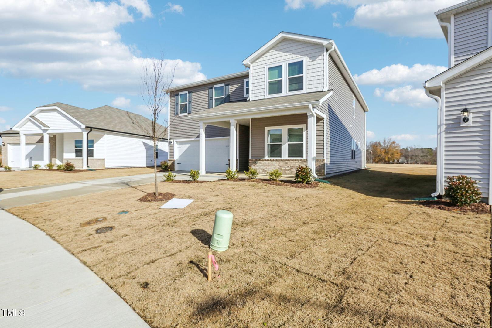 191 White Birch Lane Angier, NC 27501 - Photo 2 of 35 a front view of a house with a yard
