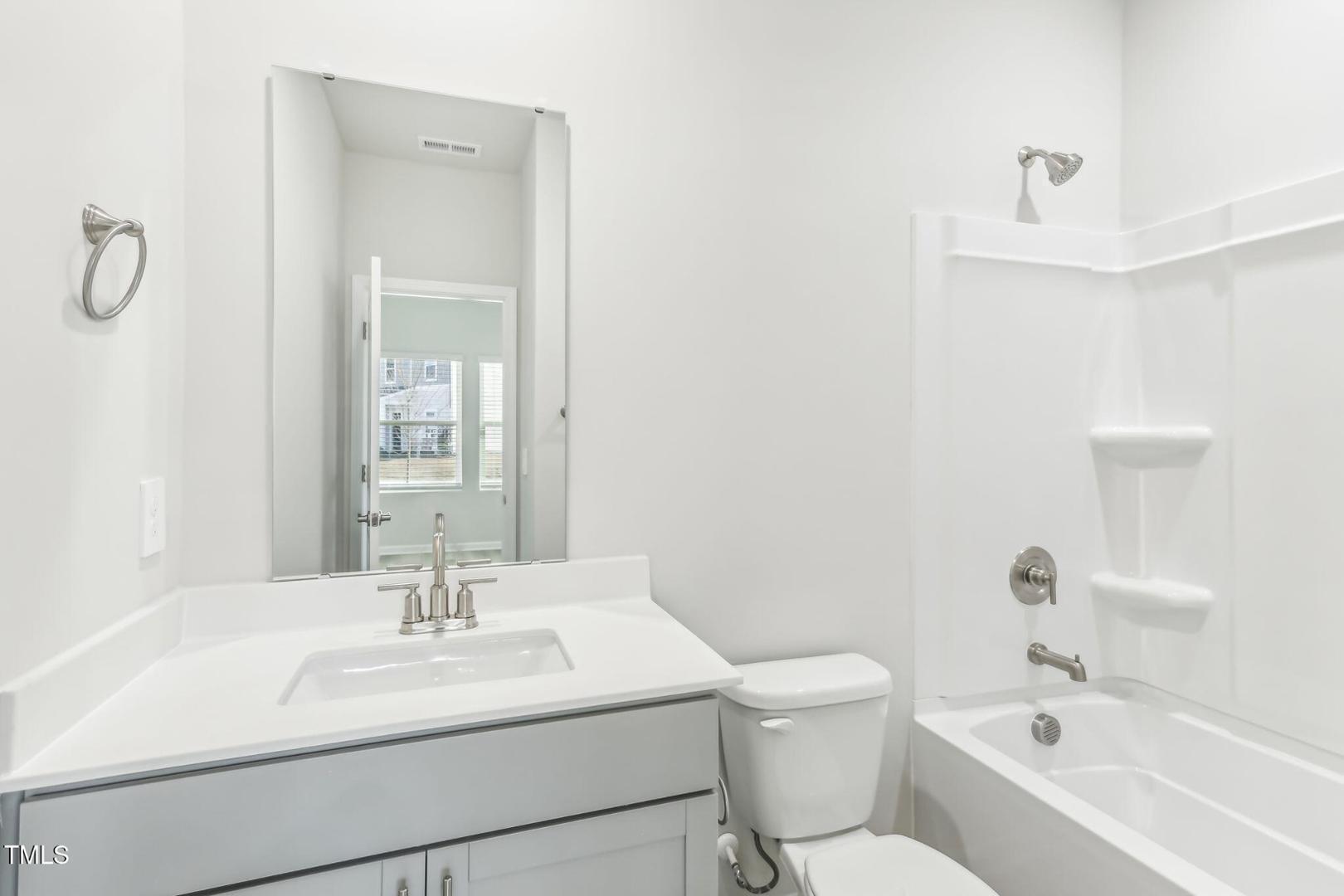 191 White Birch Lane Angier, NC 27501 - Photo 23 of 35 a bathroom with a sink toilet and shower