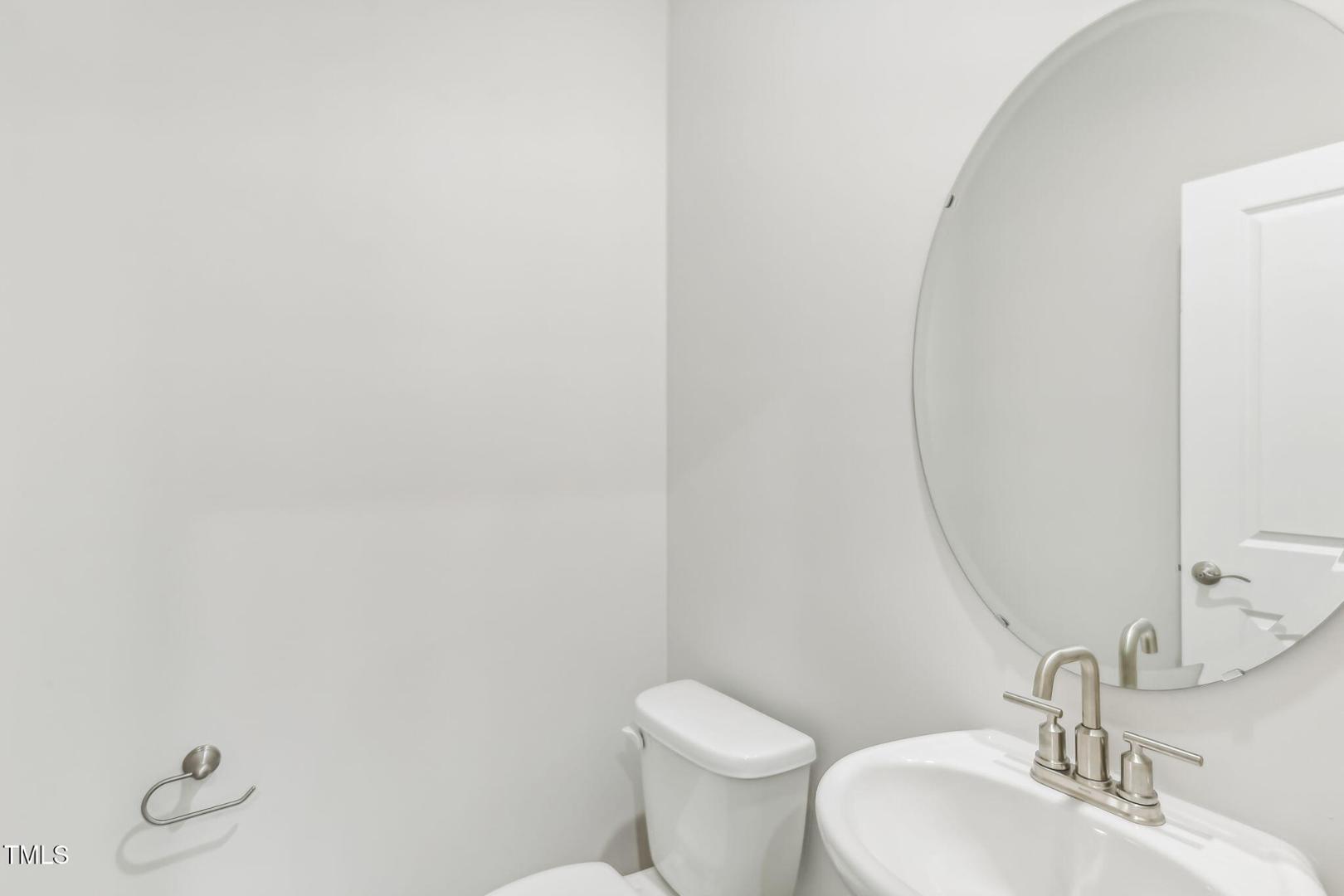 191 White Birch Lane Angier, NC 27501 - Photo 26 of 35 a bathroom with a granite countertop sink and a mirror