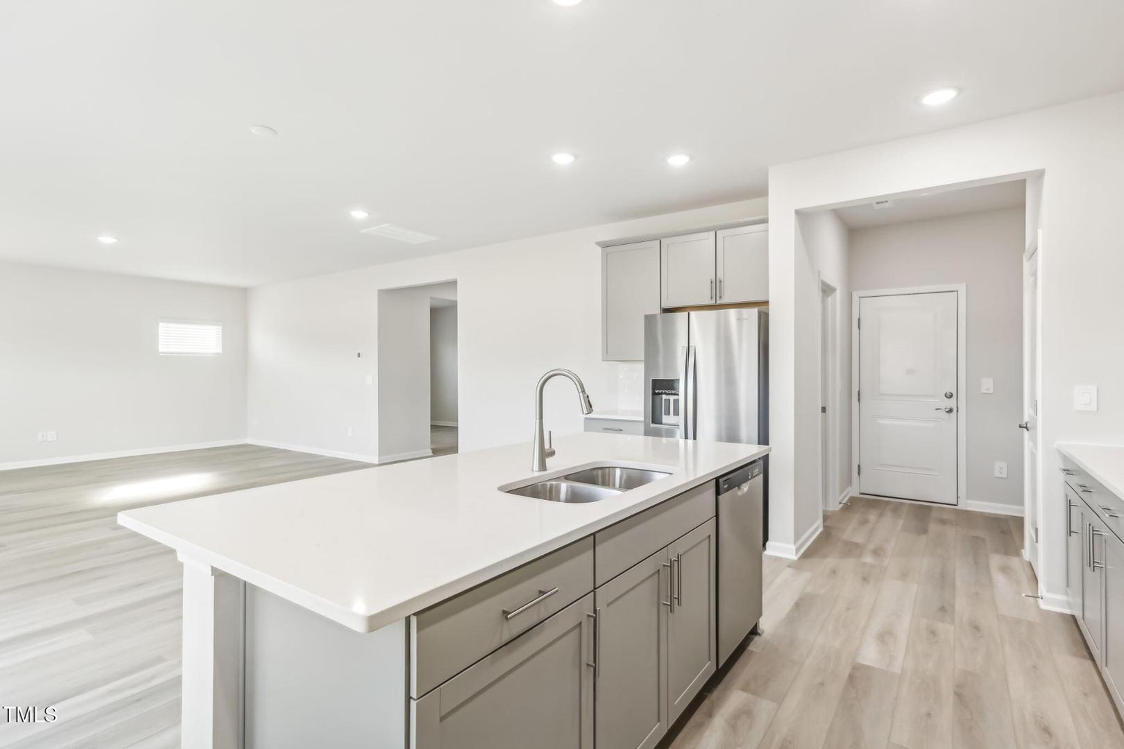 191 White Birch Lane Angier, NC 27501 - Photo 30 of 35 a spacious bathroom with a sink a mirror and a bathtub