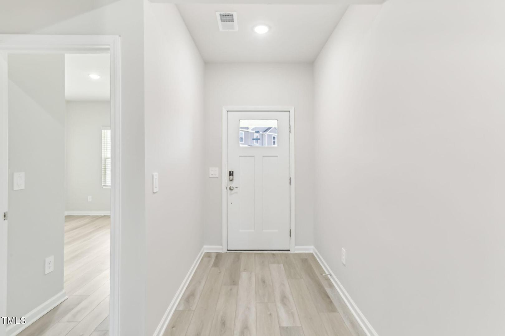 191 White Birch Lane Angier, NC 27501 - Photo 35 of 35 an empty room with wooden floor and windows