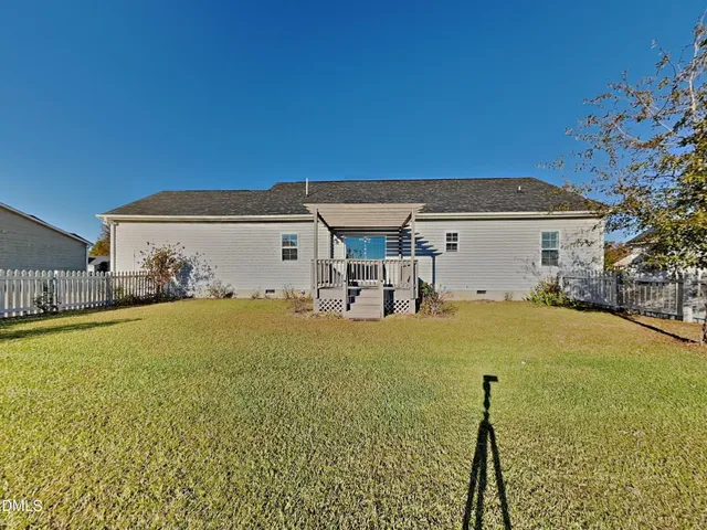 a front view of a house with yard
