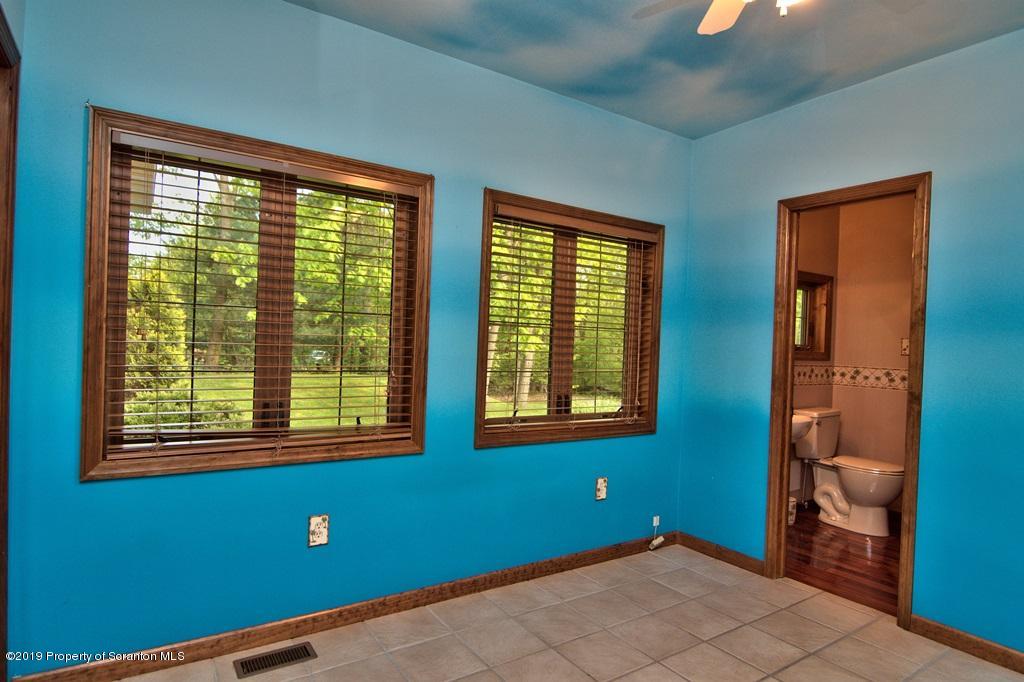 16 Pine Ridge Road Tunkhannock, PA 18657 - Photo 31 of 86 a view of an empty room with a window and a bedroom