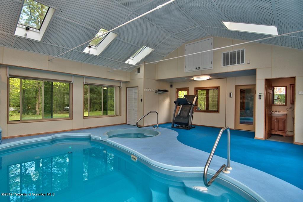 16 Pine Ridge Road Tunkhannock, PA 18657 - Photo 34 of 86 a room with pool table windows and wooden floor