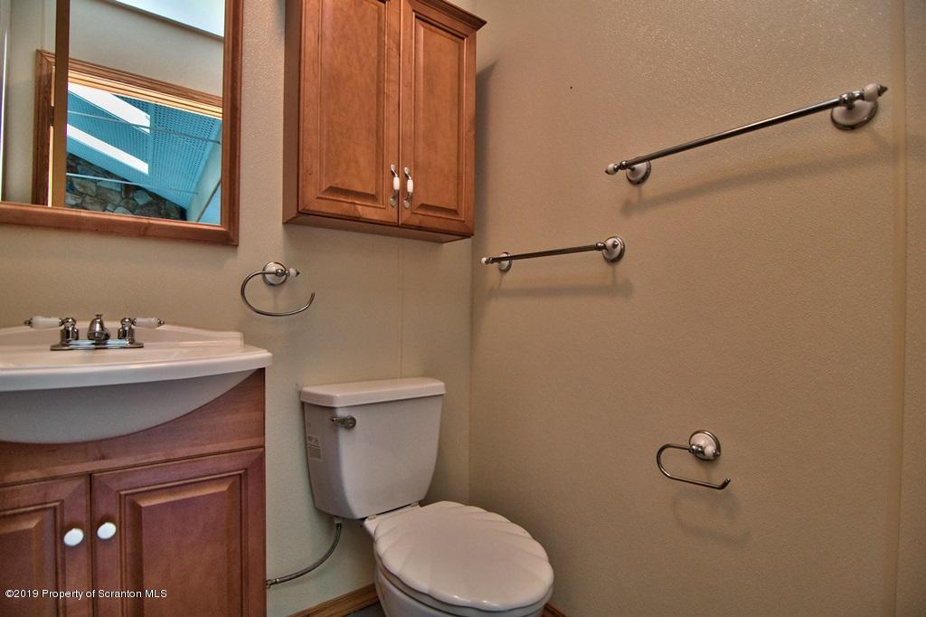 16 Pine Ridge Road Tunkhannock, PA 18657 - Photo 38 of 86 a bathroom with a sink a toilet and shower
