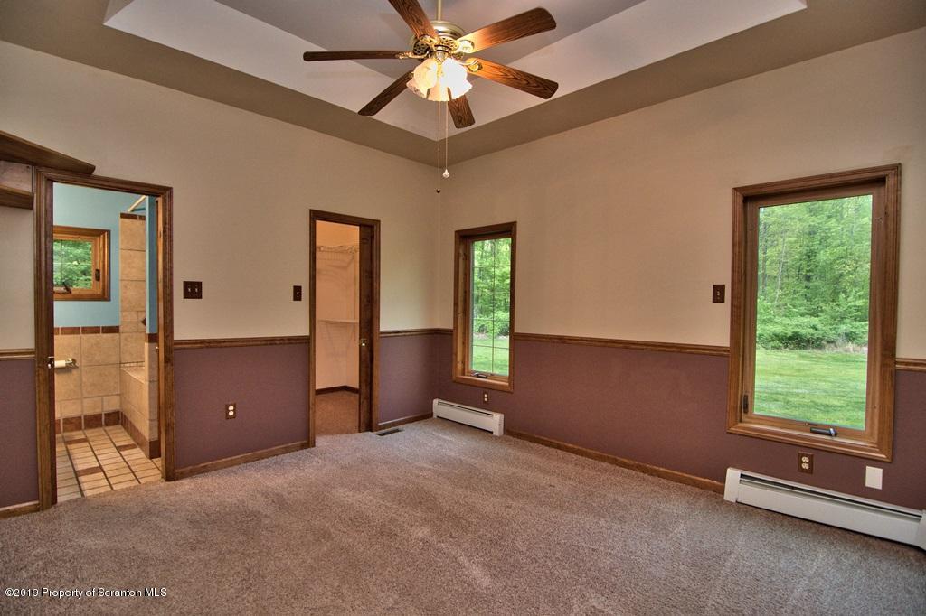 16 Pine Ridge Road Tunkhannock, PA 18657 - Photo 49 of 86 a view of an empty room with a window and kitchen view