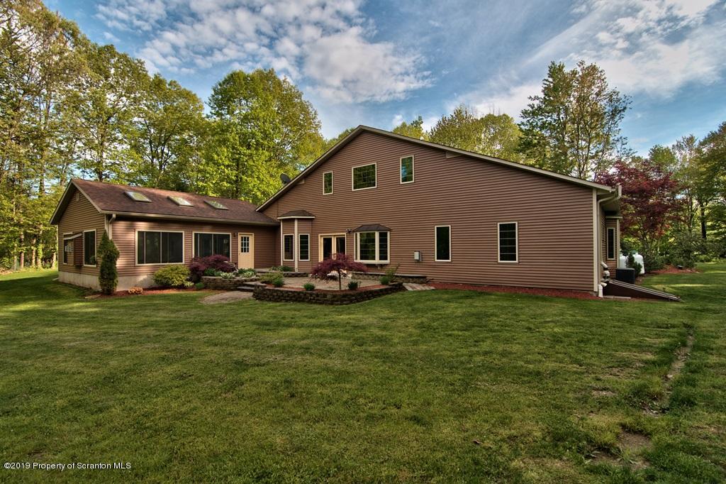 16 Pine Ridge Road Tunkhannock, PA 18657 - Photo 84 of 86 a front view of a house with garden