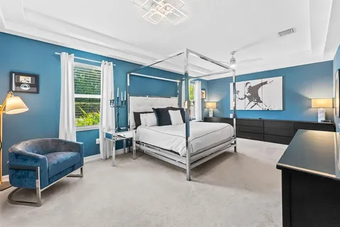 a bedroom with a bed and a couch