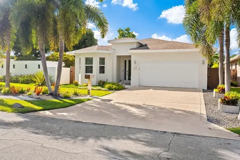 a front view of a house with swimming pool and porch
