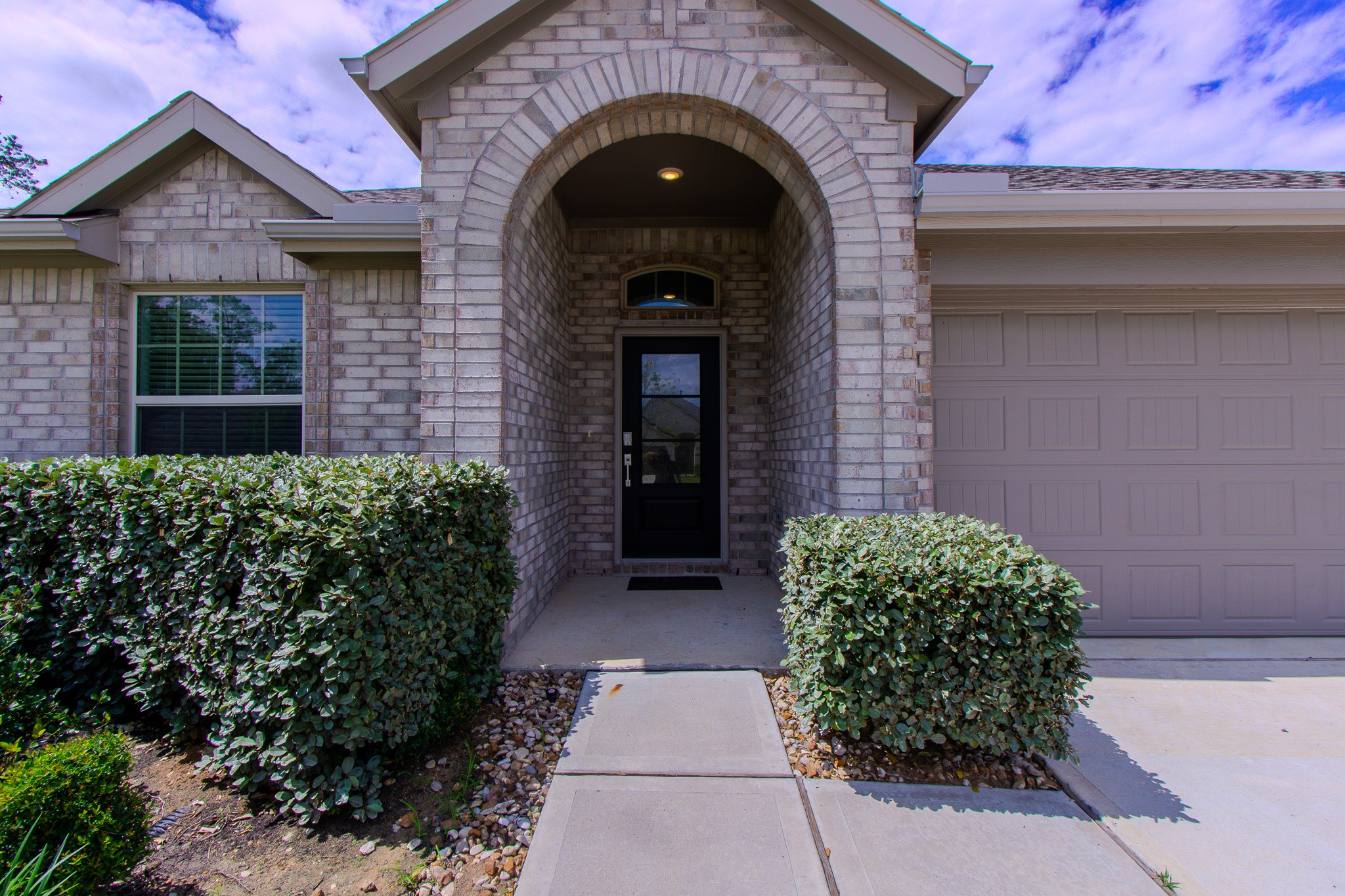 3113 Catalonion Court Conroe, TX 77301 - Photo 4 of 45 a front view of a house