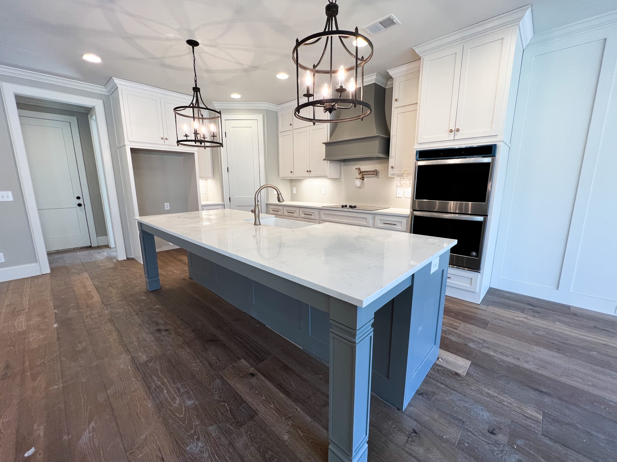 2000 Cairo Bend Road Lebanon, TN 37087 - Photo 15 of 35 a kitchen with kitchen island granite countertop a sink and wooden floor