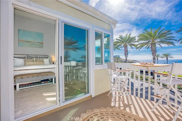 a view of a living room and a balcony