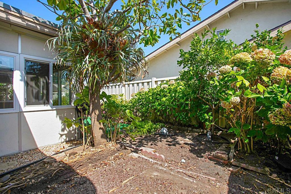 4202 Dawn Lane Oceanside, CA 92056 - Photo 15 of 23 a backyard of a house with lots of green space