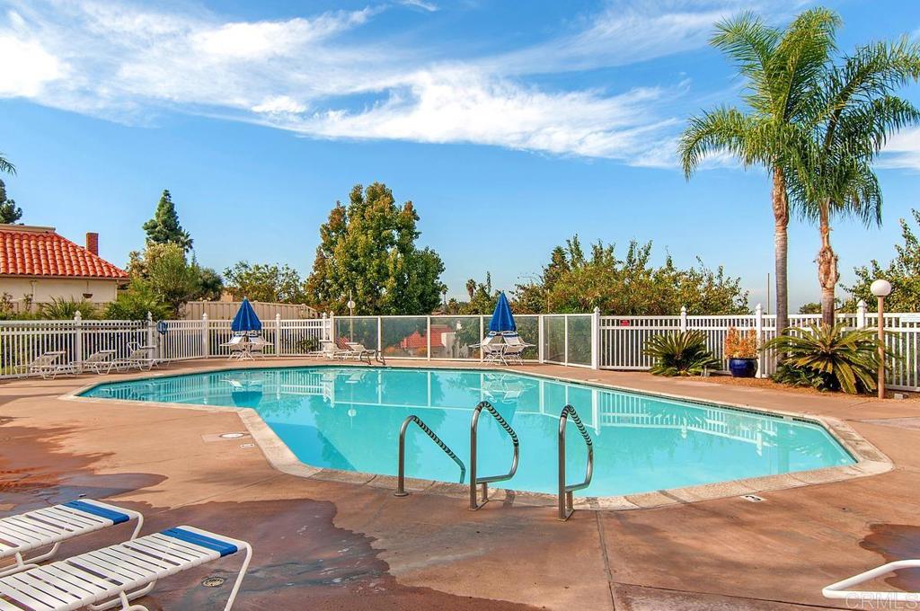4202 Dawn Lane Oceanside, CA 92056 - Photo 19 of 23 a view of a swimming pool with a lounge chairs