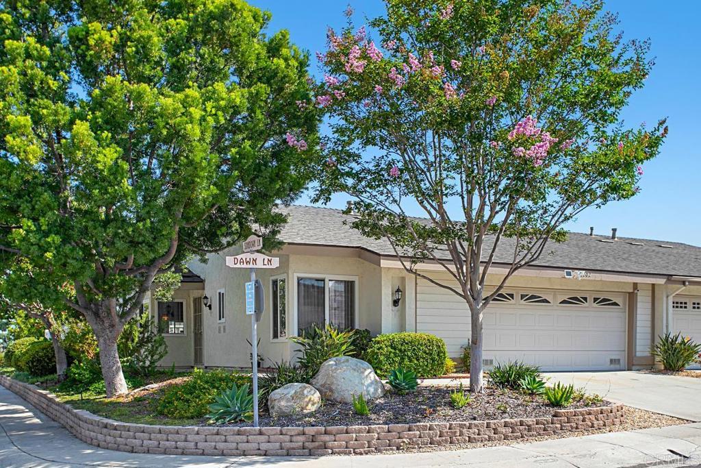 4202 Dawn Lane Oceanside, CA 92056 - Photo 2 of 23 a front view of a house with garden