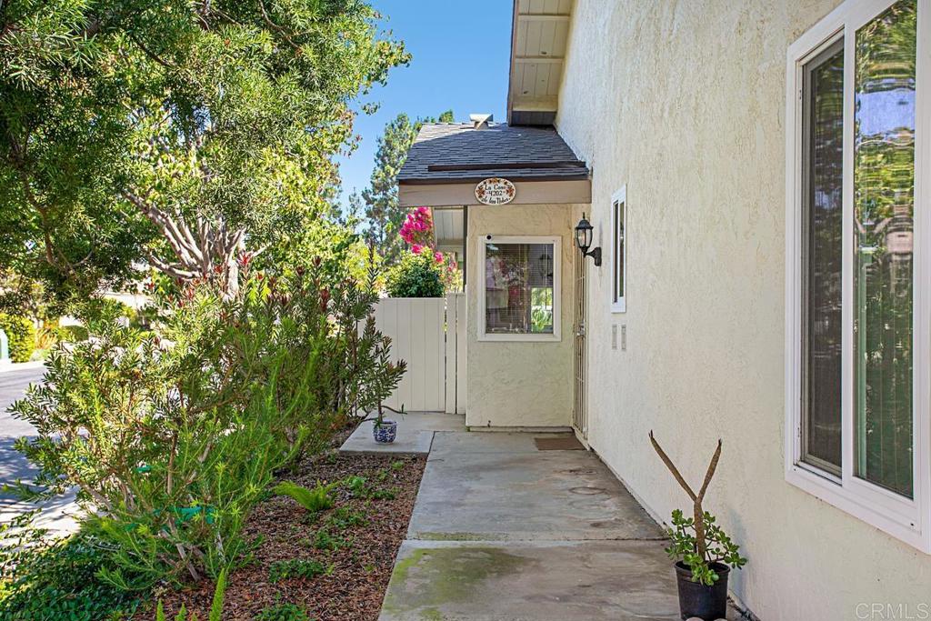 4202 Dawn Lane Oceanside, CA 92056 - Photo 3 of 23 a front view of a house with a yard