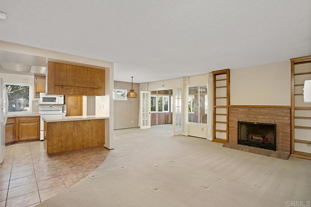 4202 Dawn Lane Oceanside, CA 92056 - Photo 5 of 23 a view of an empty room with a fireplace