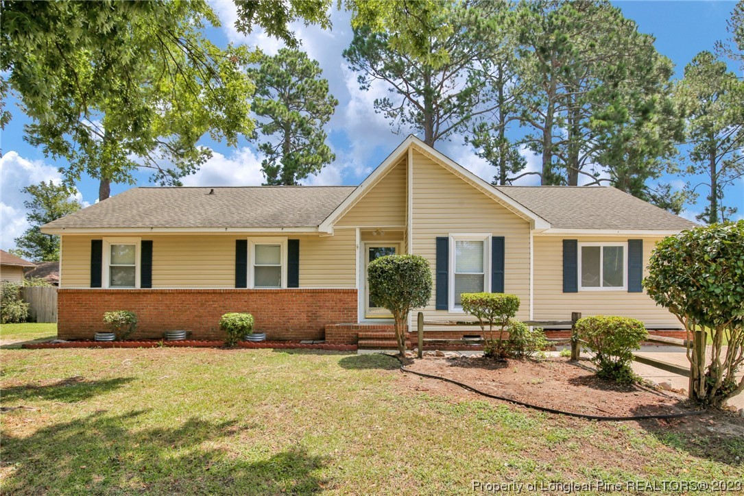 a front view of a house with a yard outdoor seating and yard