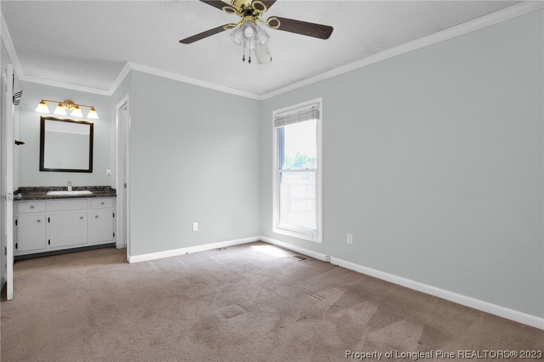 3675 Applegate Road Hope Mills, NC 28348 - Photo 15 of 32 a view of a hallway with a bathroom