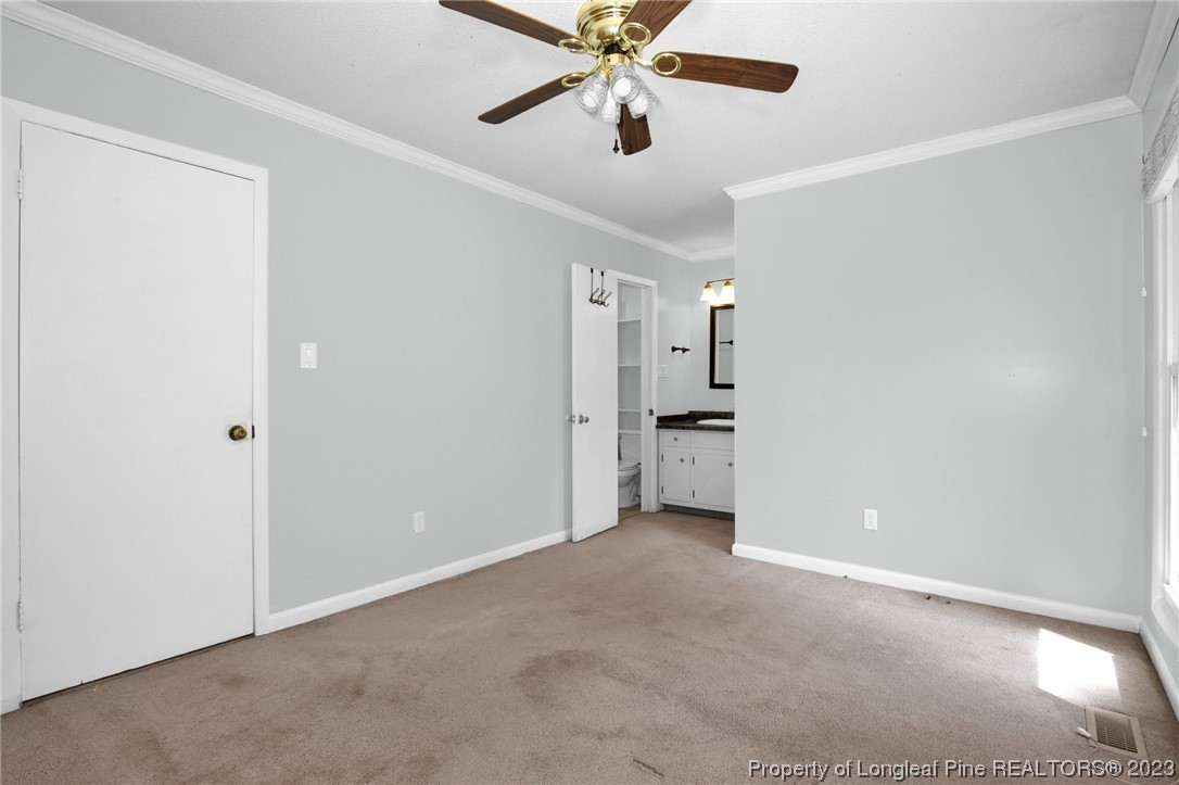 3675 Applegate Road Hope Mills, NC 28348 - Photo 16 of 32 a view of a kitchen with a sink and a refrigerator