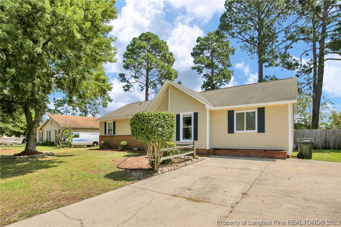 3675 Applegate Road Hope Mills, NC 28348 - Photo 2 of 32 a view of a house with a backyard