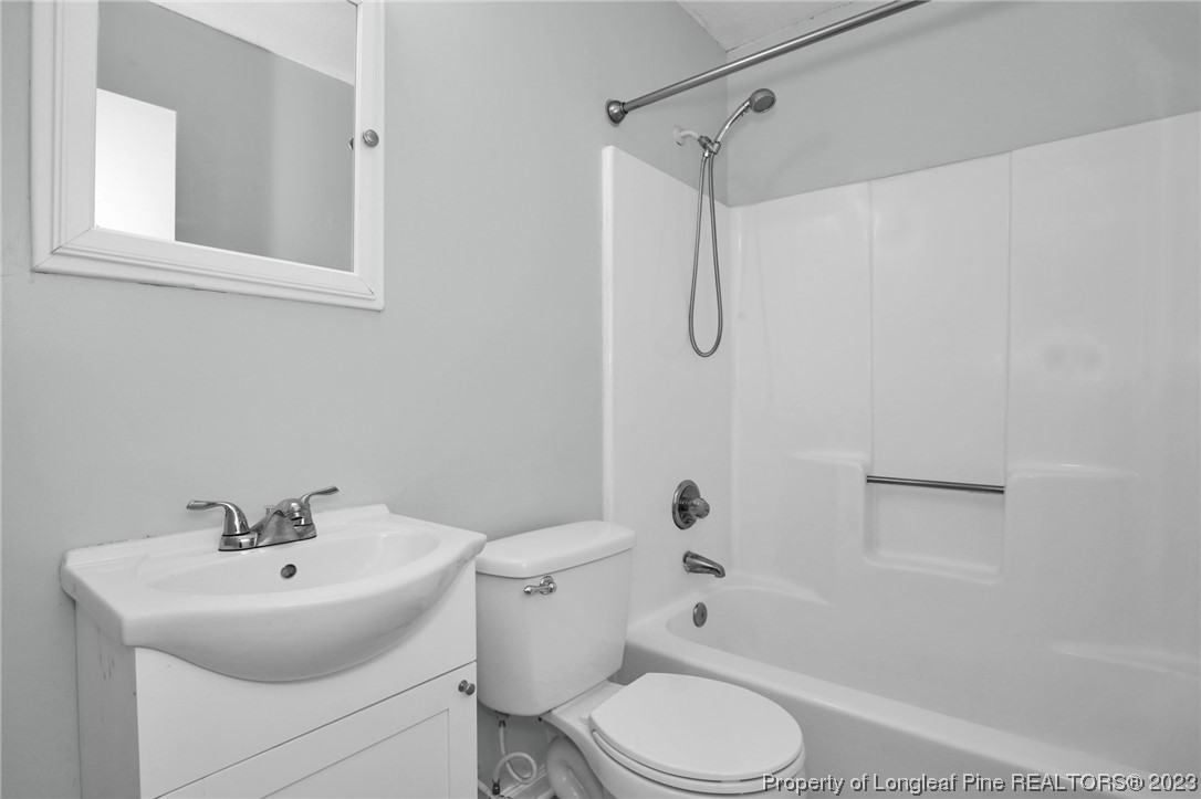 3675 Applegate Road Hope Mills, NC 28348 - Photo 24 of 32 a bathroom with a sink toilet and shower