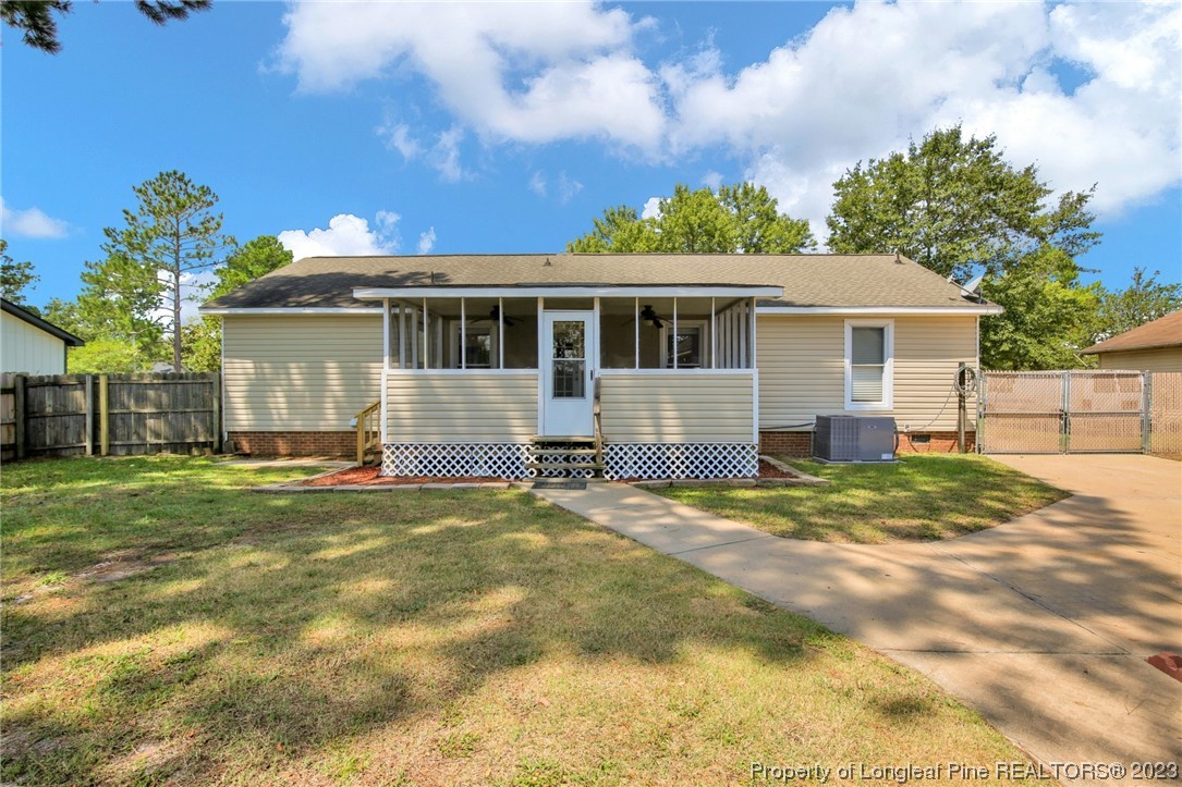 3675 Applegate Road Hope Mills, NC 28348 - Photo 26 of 32 a view of a house with a yard