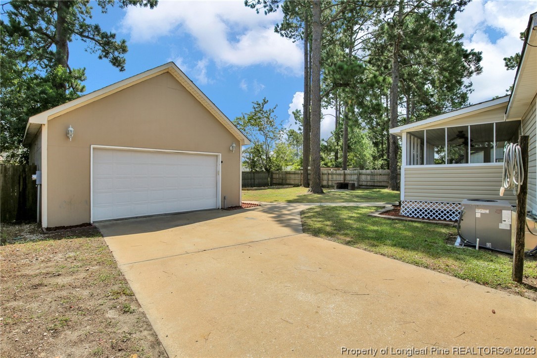 3675 Applegate Road Hope Mills, NC 28348 - Photo 28 of 32 a view of a house with a yard
