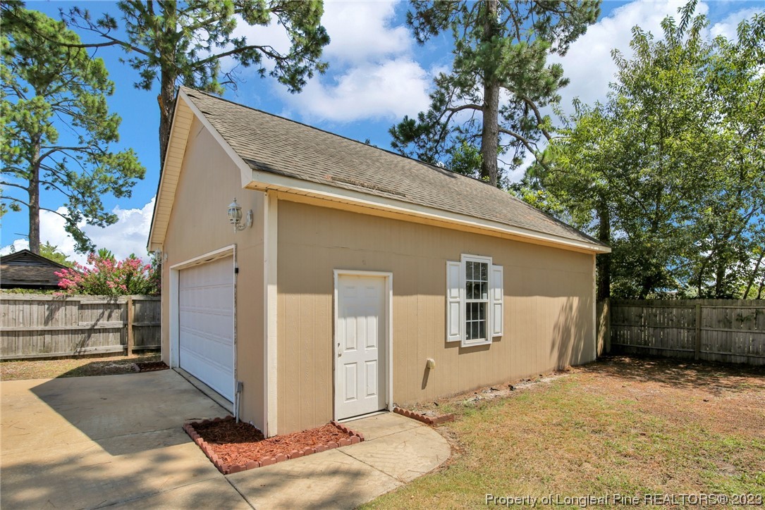 3675 Applegate Road Hope Mills, NC 28348 - Photo 29 of 32 a front view of a house with a garage