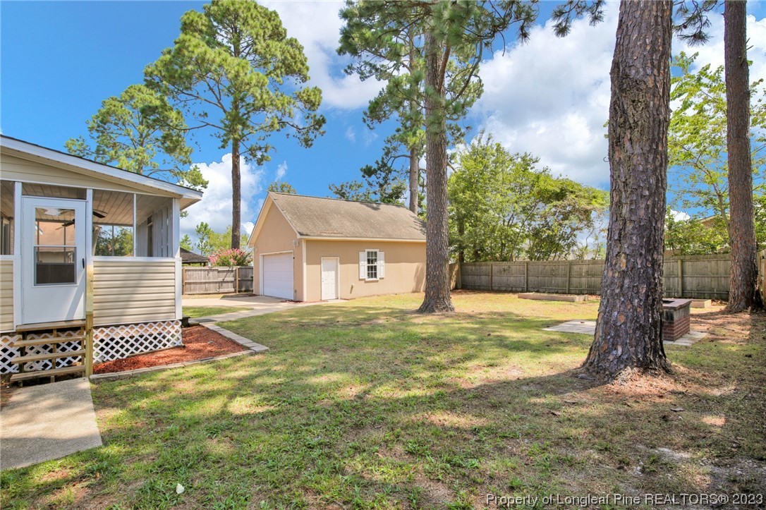 3675 Applegate Road Hope Mills, NC 28348 - Photo 30 of 32 a view of a house with a yard and tree s