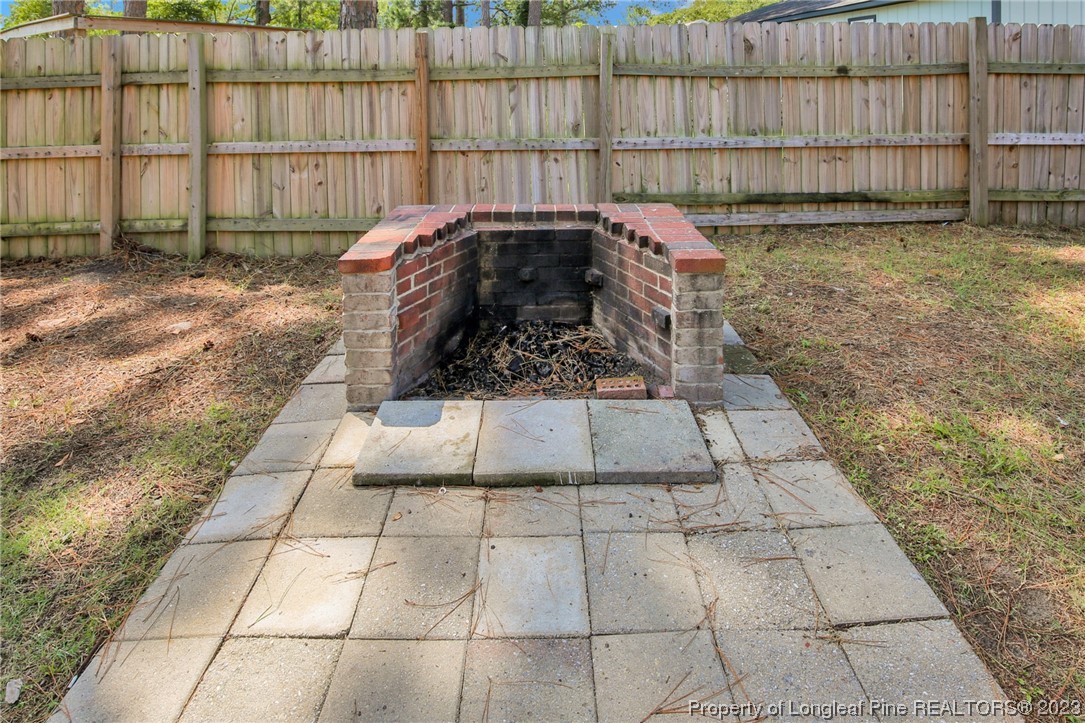 3675 Applegate Road Hope Mills, NC 28348 - Photo 32 of 32 a view of a backyard with a wooden fence