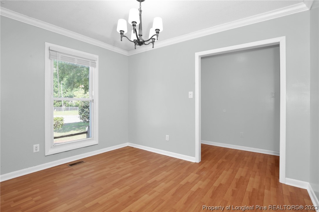 3675 Applegate Road Hope Mills, NC 28348 - Photo 5 of 32 a view of empty room with wooden floor and fan