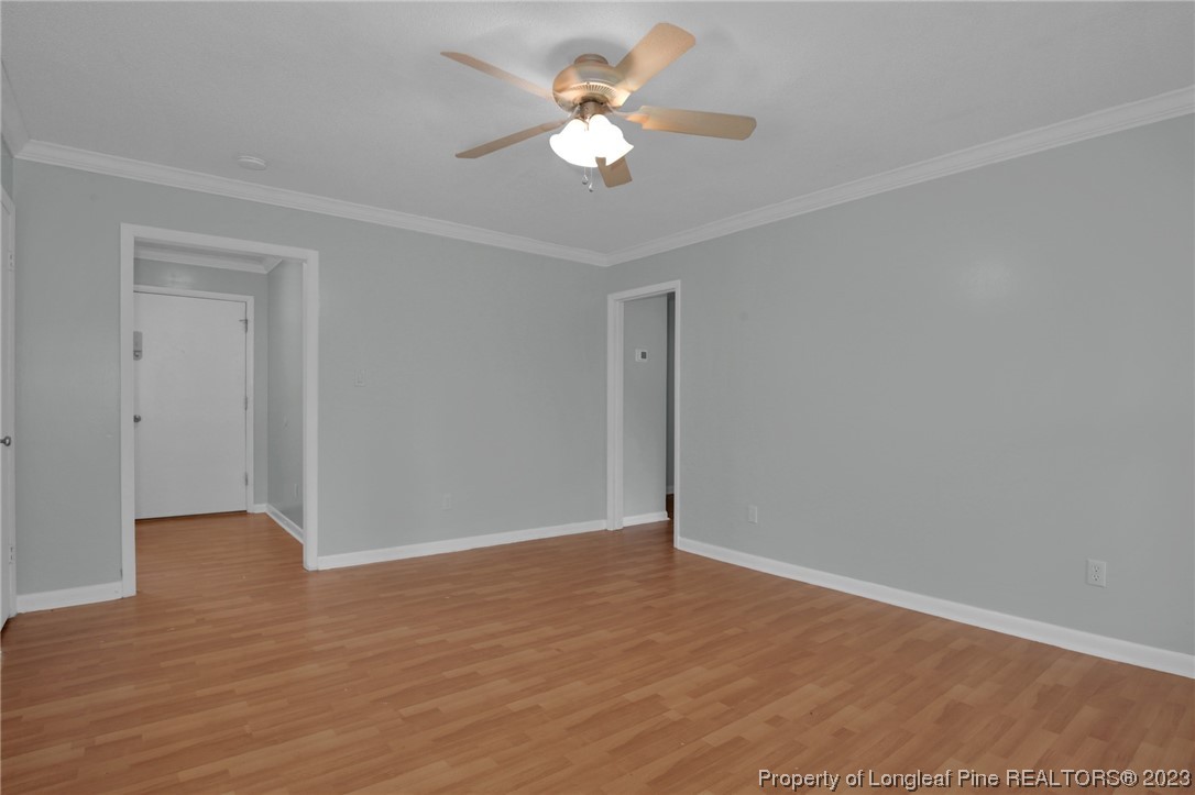 3675 Applegate Road Hope Mills, NC 28348 - Photo 6 of 32 a view of an empty room with wooden floor