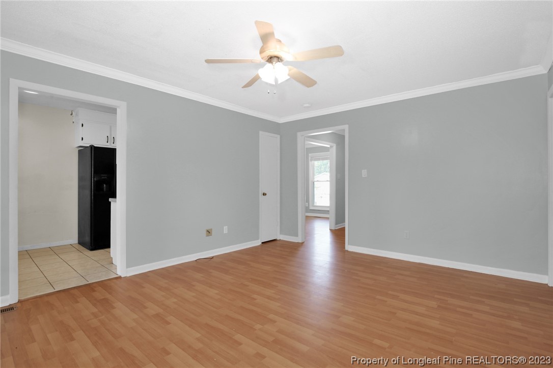 3675 Applegate Road Hope Mills, NC 28348 - Photo 9 of 32 a view of an empty room with wooden floor