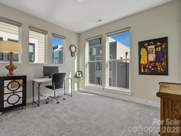 a workspace with furniture and window