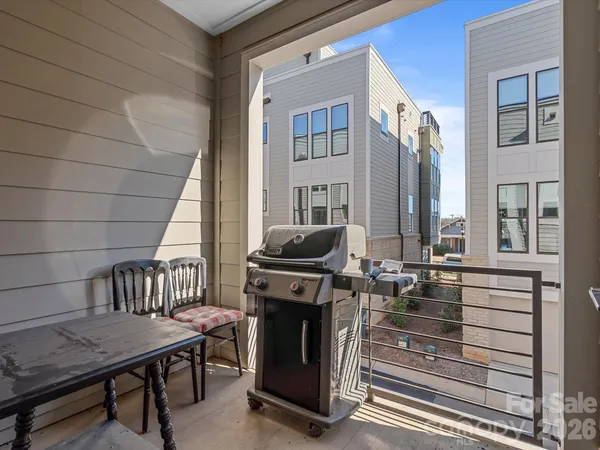 a view of a balcony and chairs